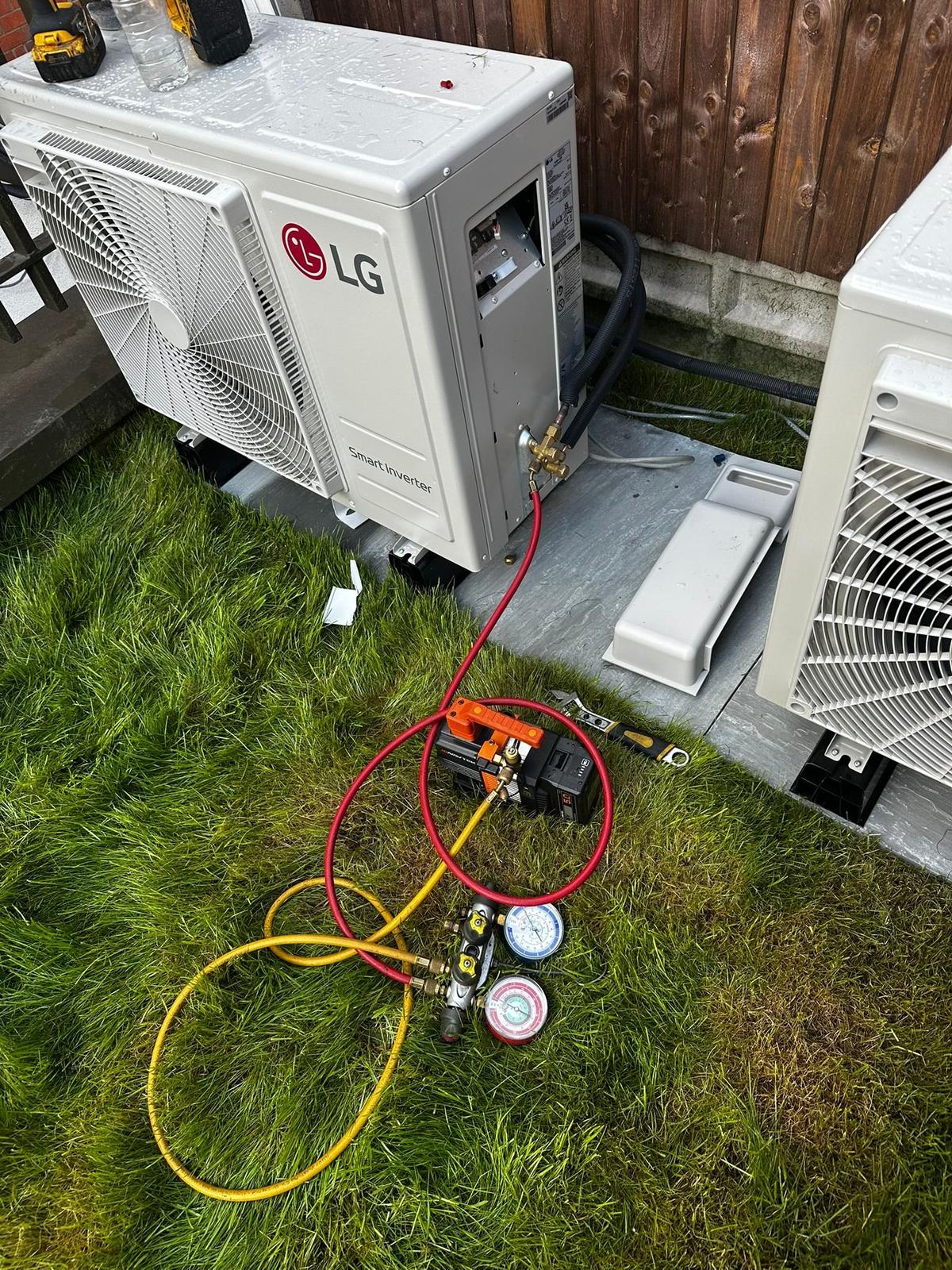 LG smart inverter outdoor units being commissioned with refrigerant gauges