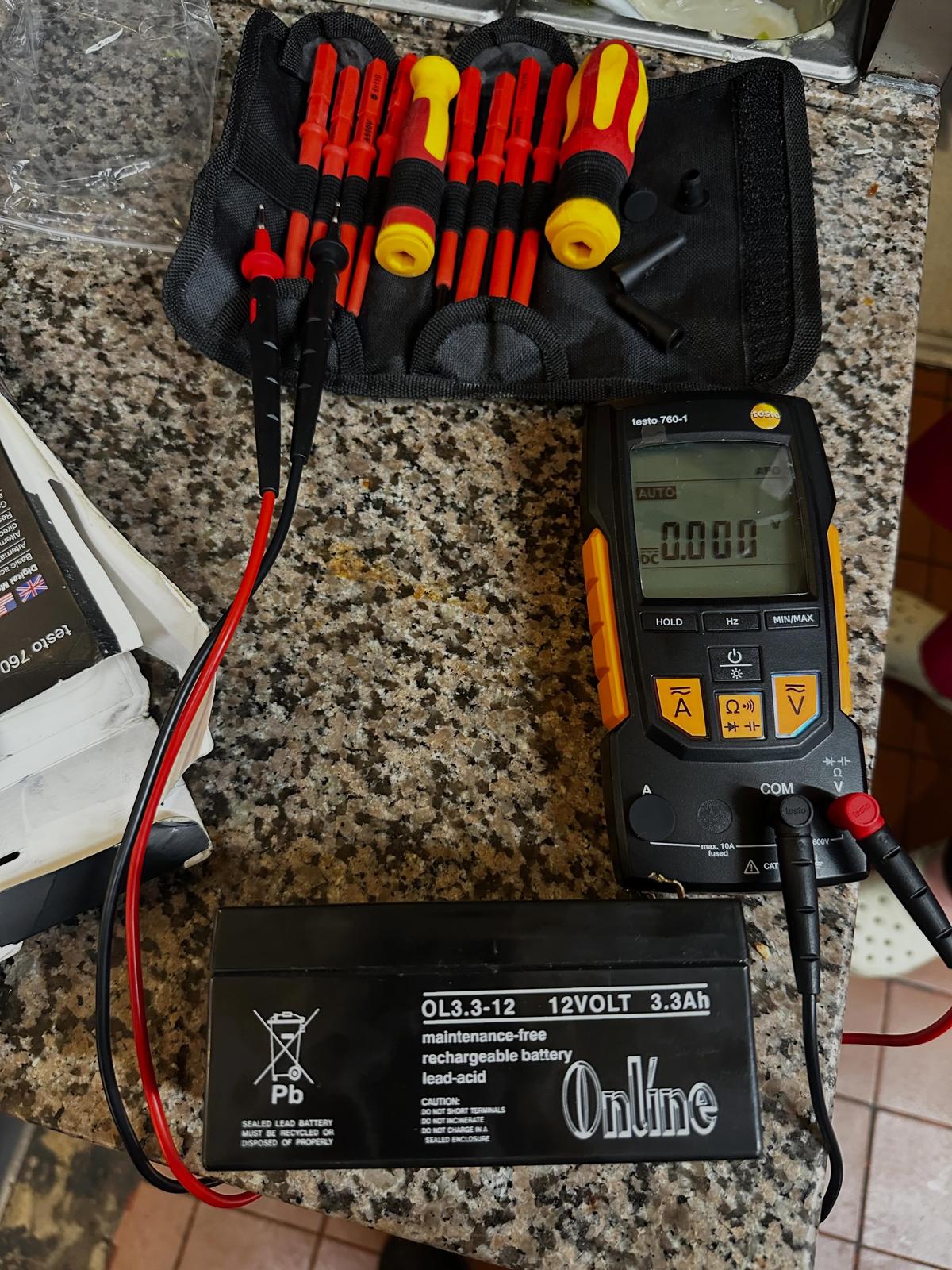 Electrical work - multimeter and battery