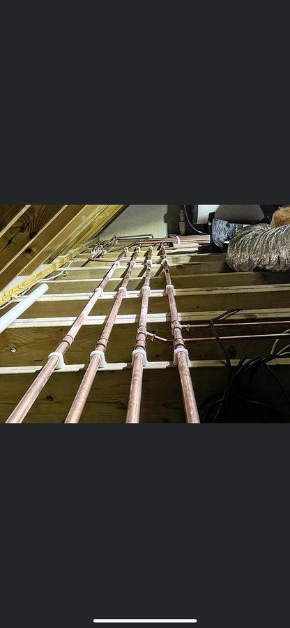 Copper pipe runs in loft space